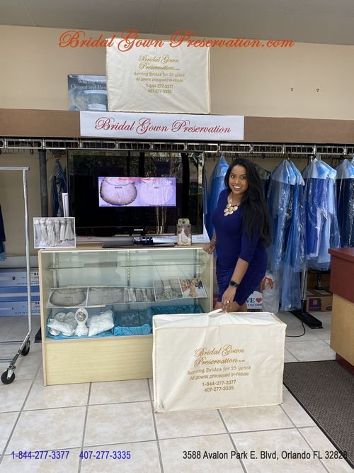 Bride picking up her Wedding Gown